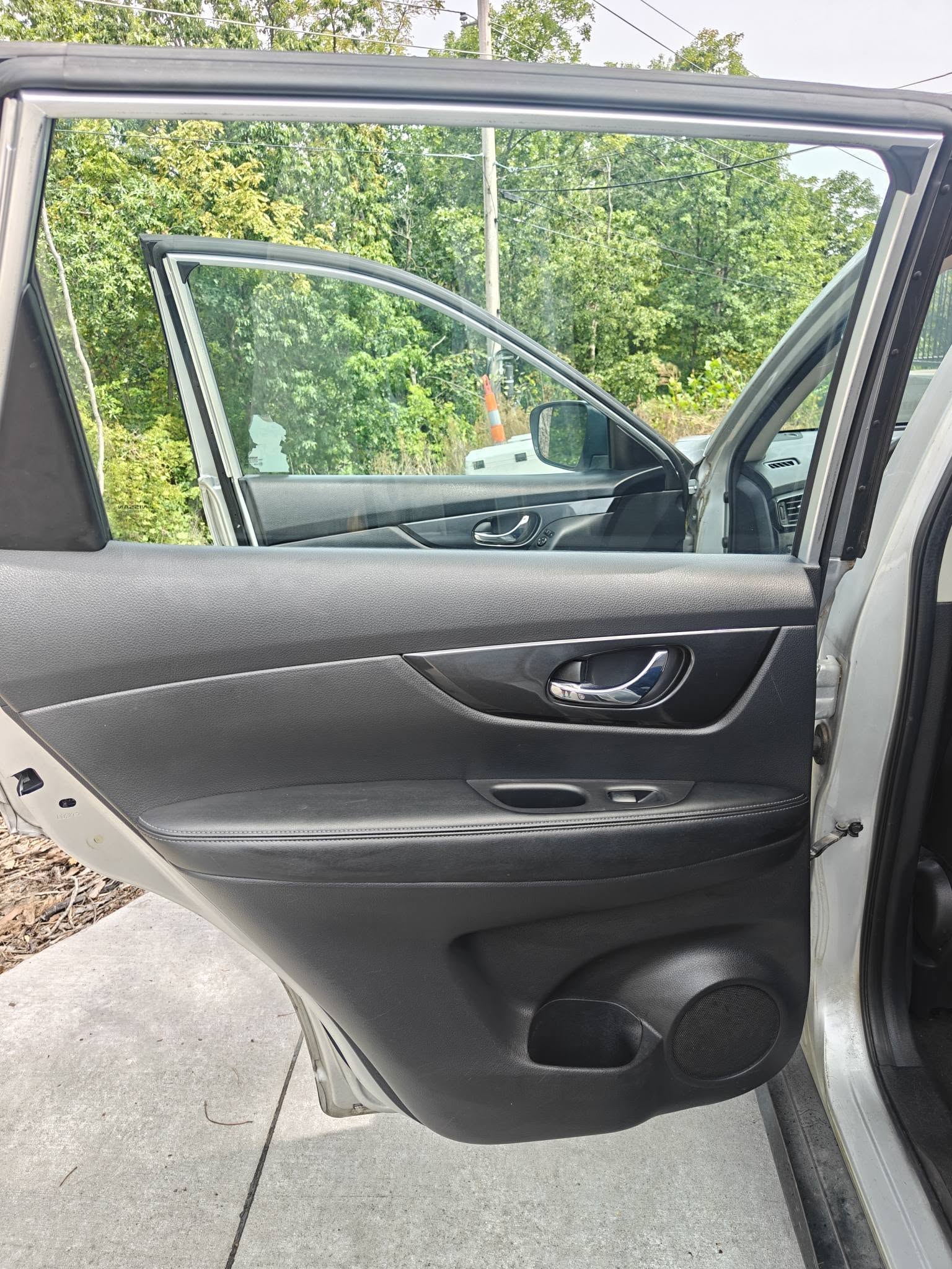A freshly detailed SUV interior with clean tan leather seats and spotless carpet